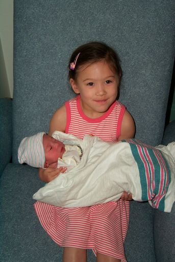 Big sister holding Henry